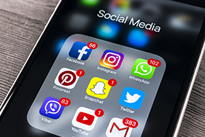 2020-Social-Media-Research photo of a smart phone with various social media icons on the screen
