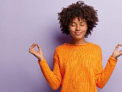 photo of a young woman in a meditative pose