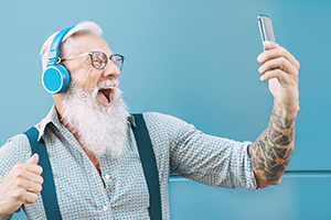 elderly-mobile-phone photo of a senior man looking at a smartphone