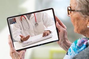 Kyruss photo of a physician and patient in a telemedicine session