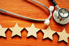 image of 5 review stars under a stethoscope