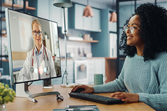 remote-monitoring photo of a patient and a physician in a virtual video visit