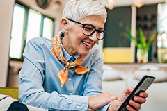 photo of a senior woman looking at a smartphone