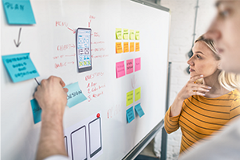 user-experience photo of 2 people working on a website redesign