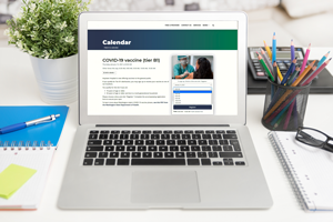 vaccination-website photo of a COVID-19 vaccine website on a laptop computer