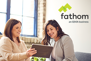 fathom photo of 2 women looking at a tablet