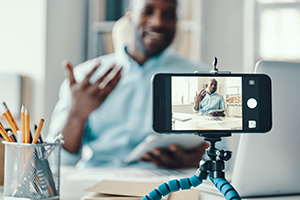 photo of a person watching a video on a smartphone