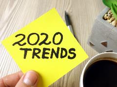 photo of a person holding a note that reads "2020 trends"