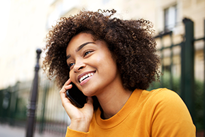 voice-calls photo of a young woman talking on a cell phone
