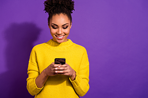 phone-use photo of a young woman looking at a smartphone
