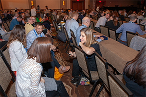 photo of conference attendees talking together